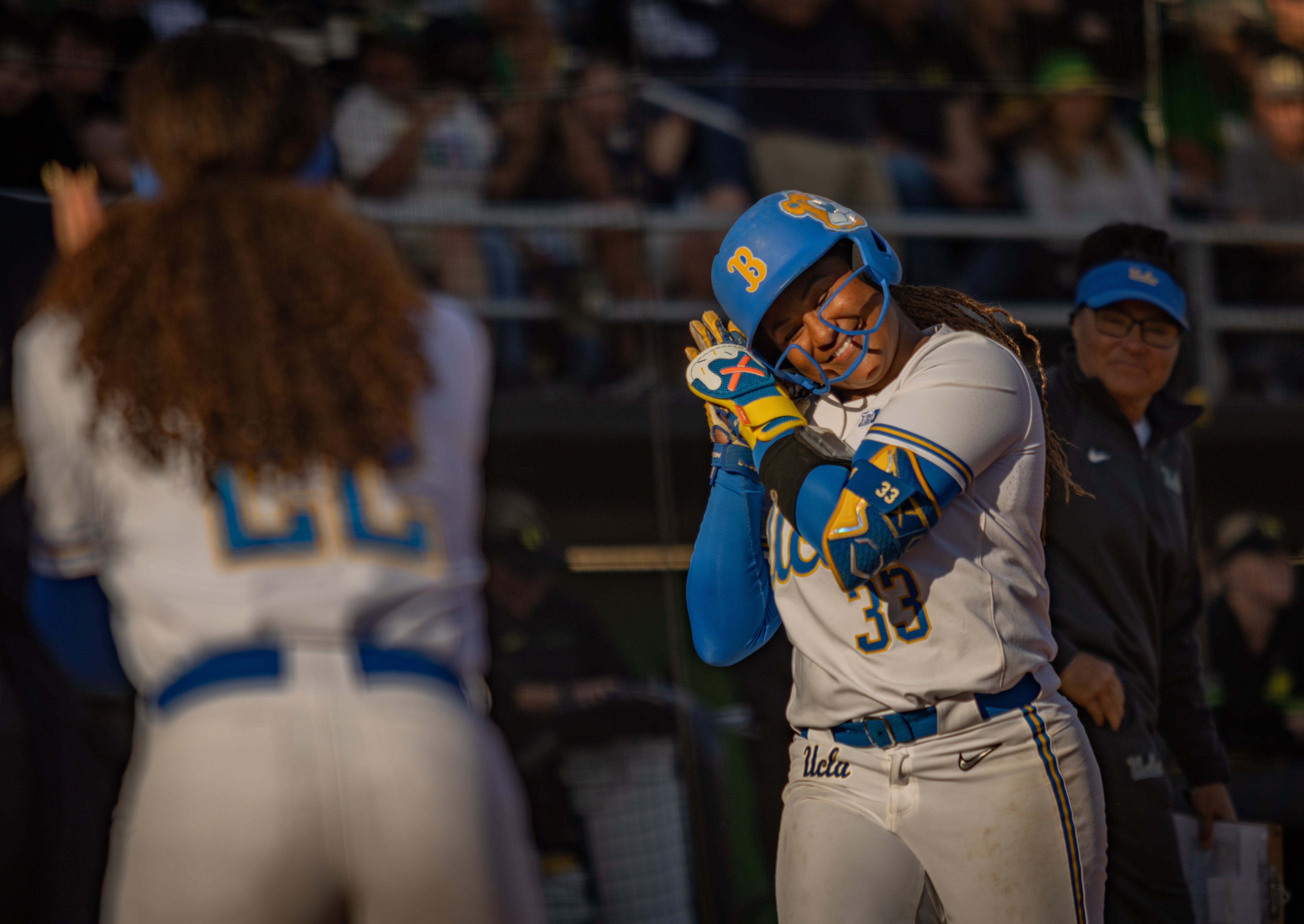 UCLA softball celebrates during 8-0 victory against Oregon on April 19.