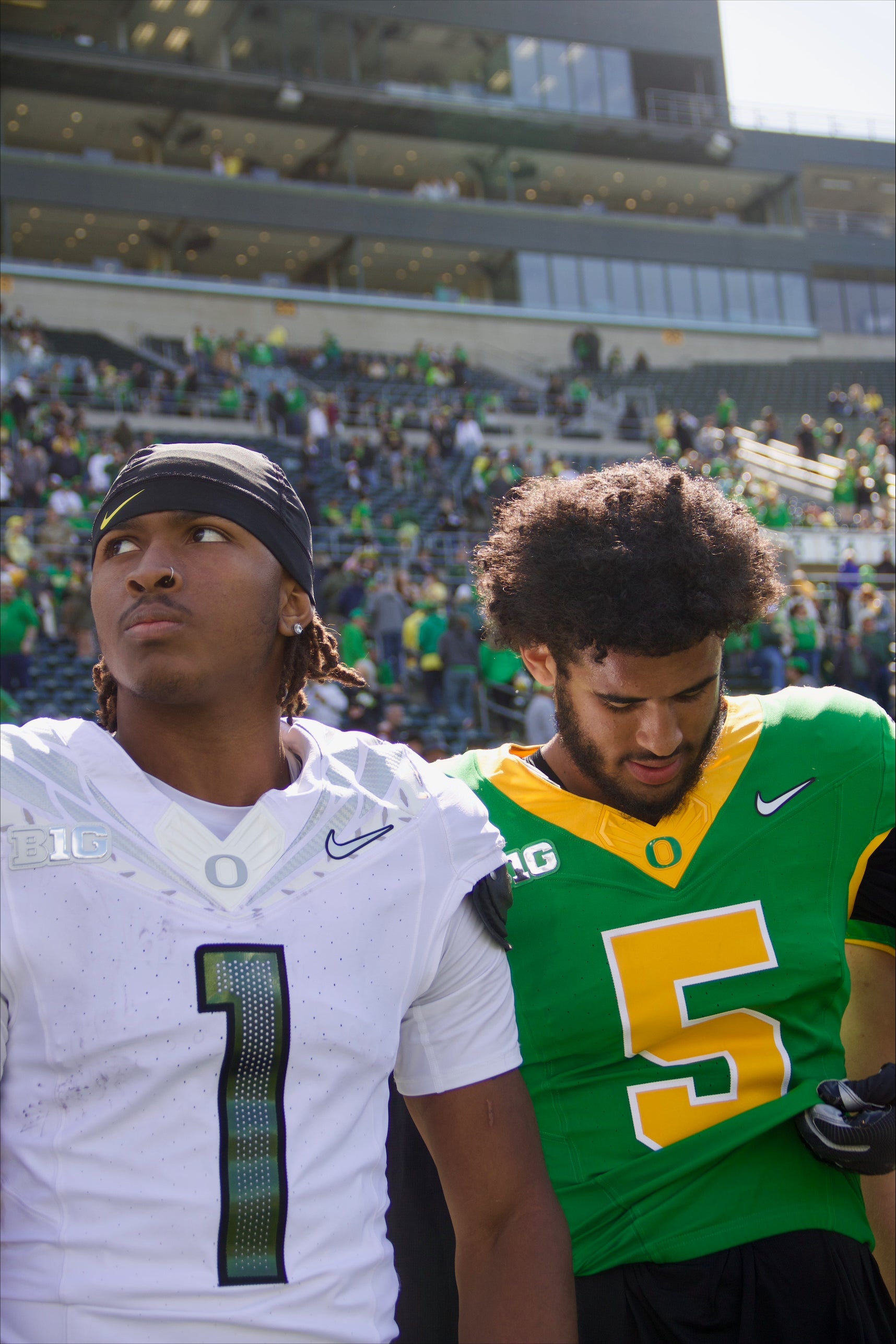 Dante Moore and Dakorien Moore pictured in uniform ahead of Oregon football's 2025 Spring Game.