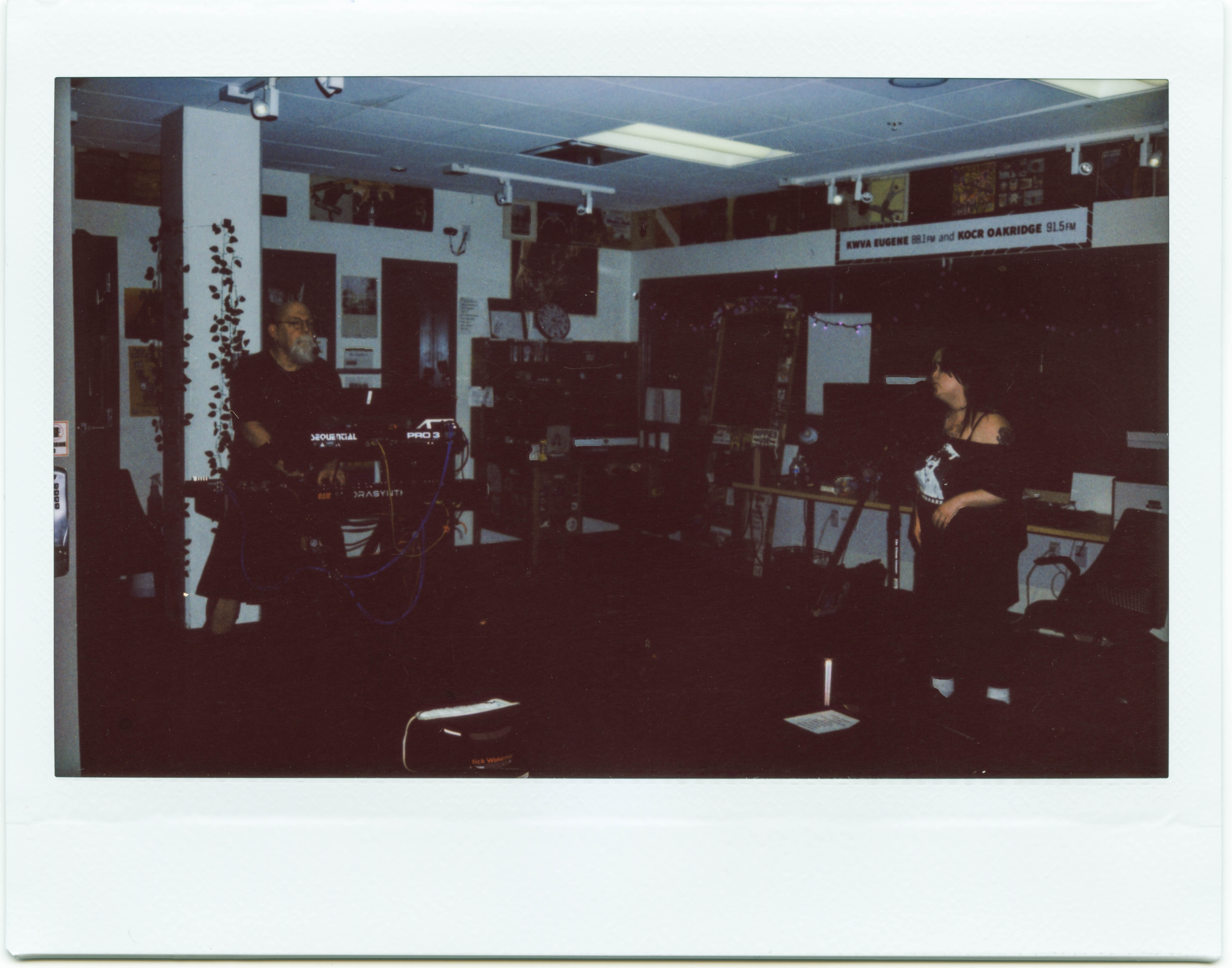 Polaroid framed picture showing the electronic music group Rabyd Rabbyt performing in the KWVA studios