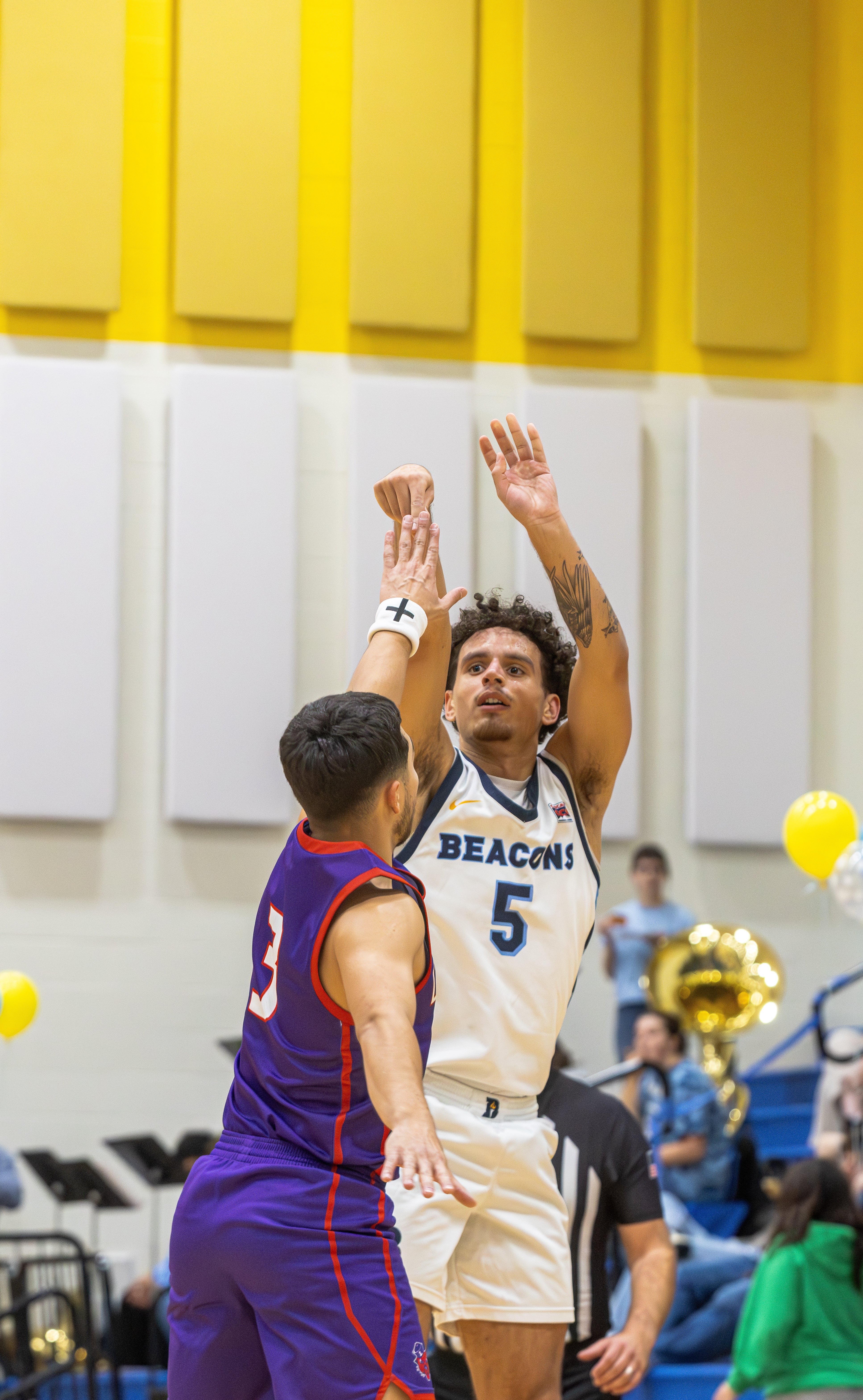 Bushnell's Squeeky Johnson shoots a jumpshot over a defender