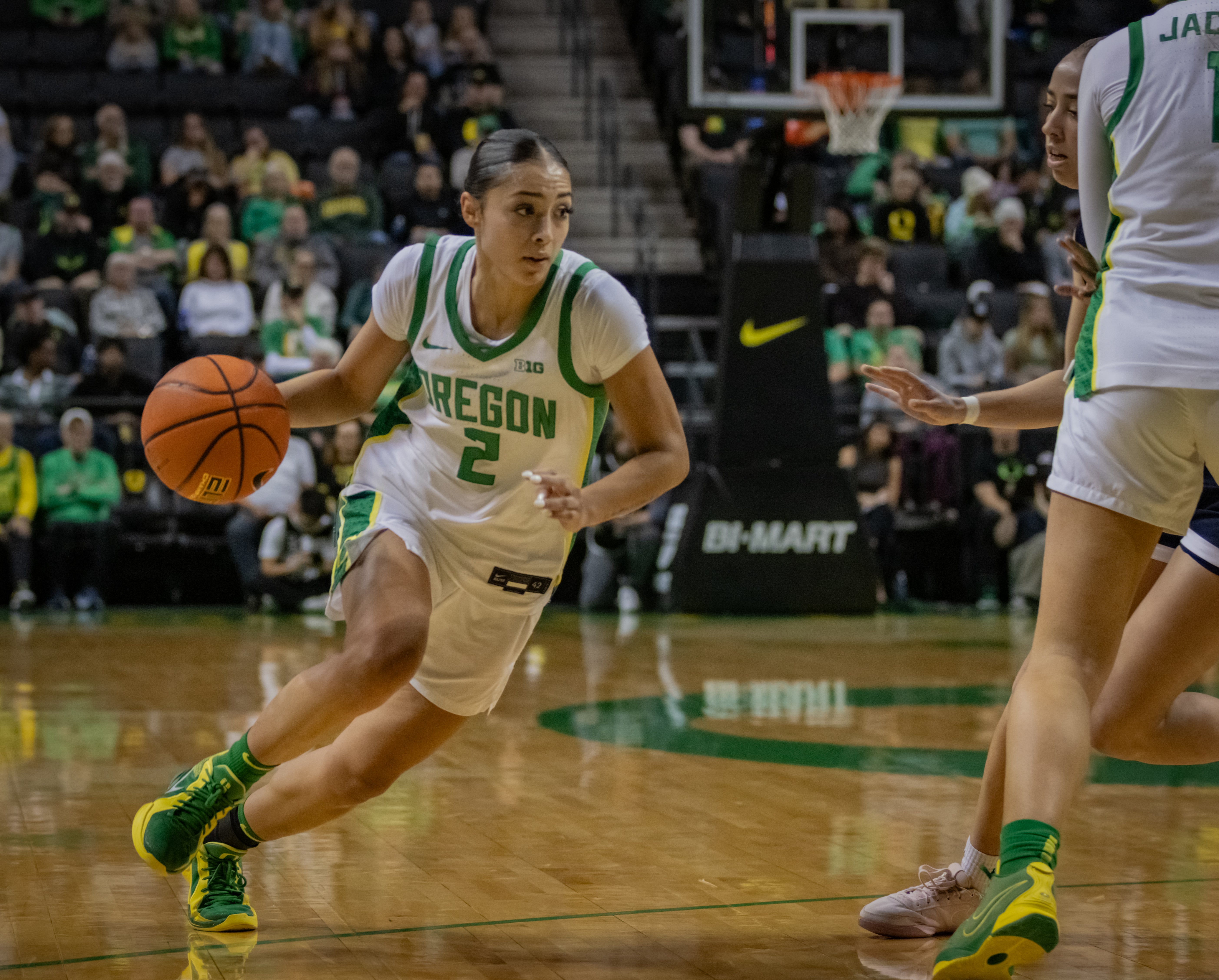 Oregon women's basketball guard Katie Fiso drives to the hoop against Utah State