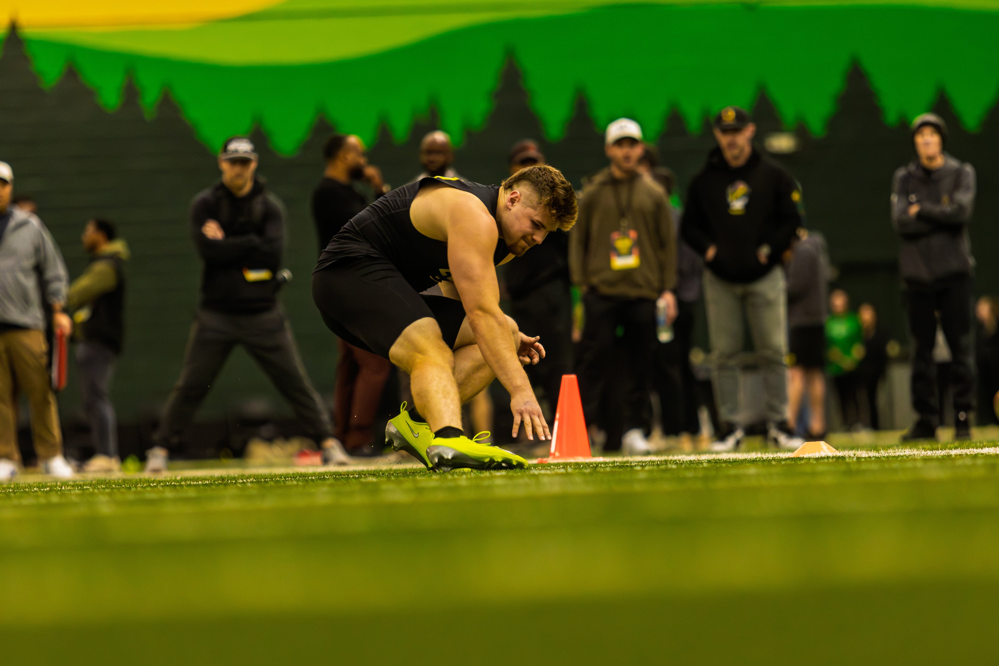 Oregon's Bryce Boettcher reaches to touch a cone during a shuttle drill at the Ducks' Pro Day