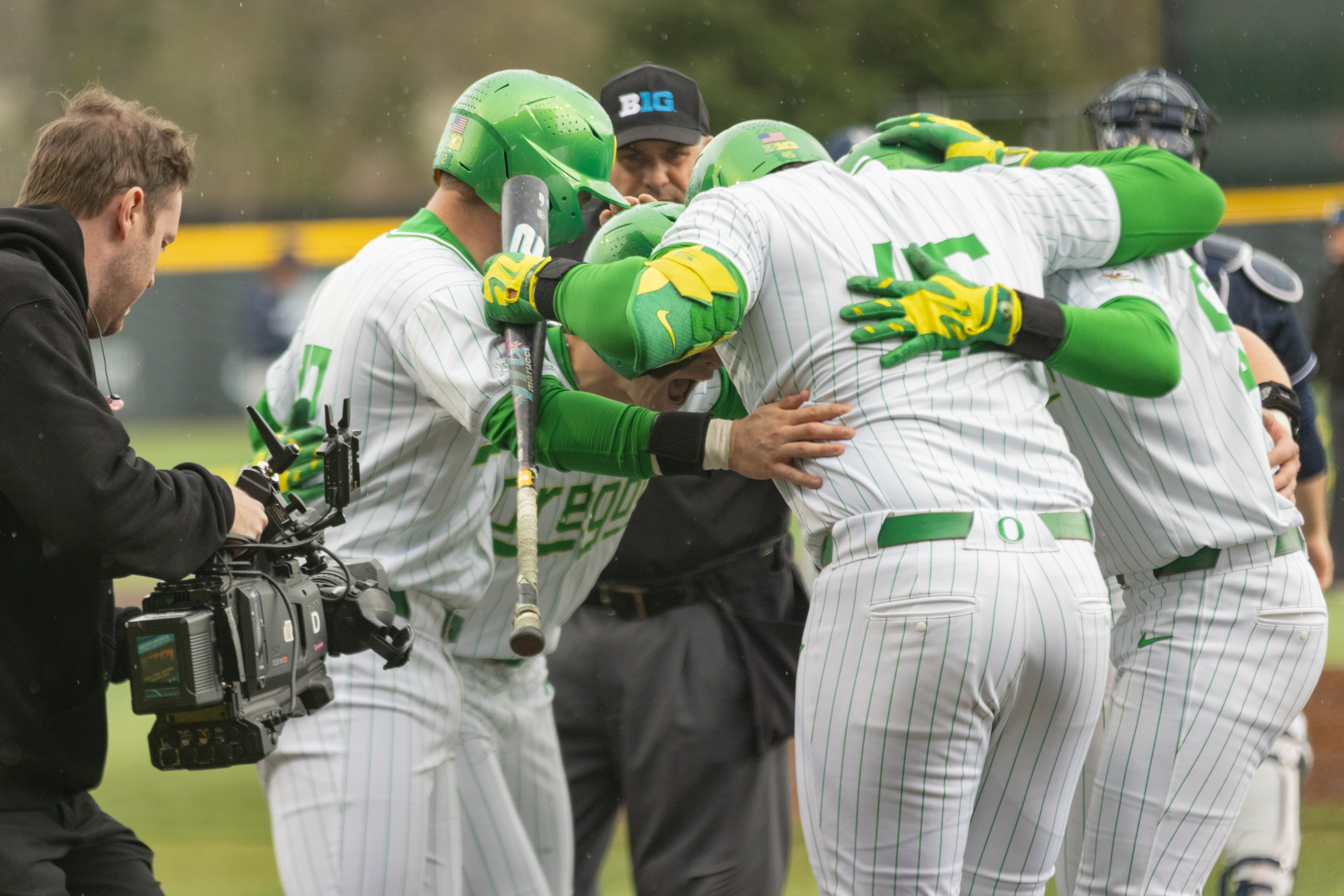 The Oregon Ducks baseball team celebrates after a home run