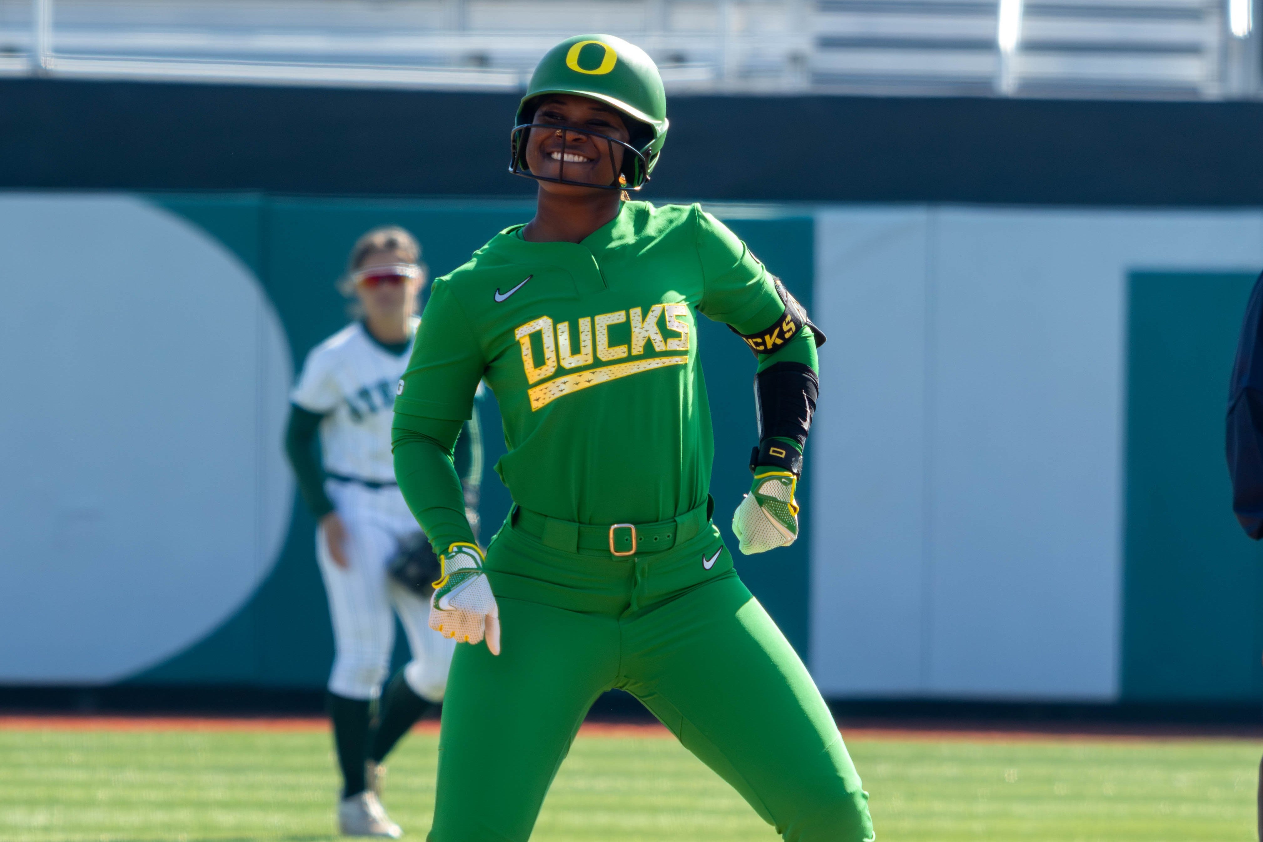 Oregon's Elon Butler celebrates on second base after sliding in safely with a double