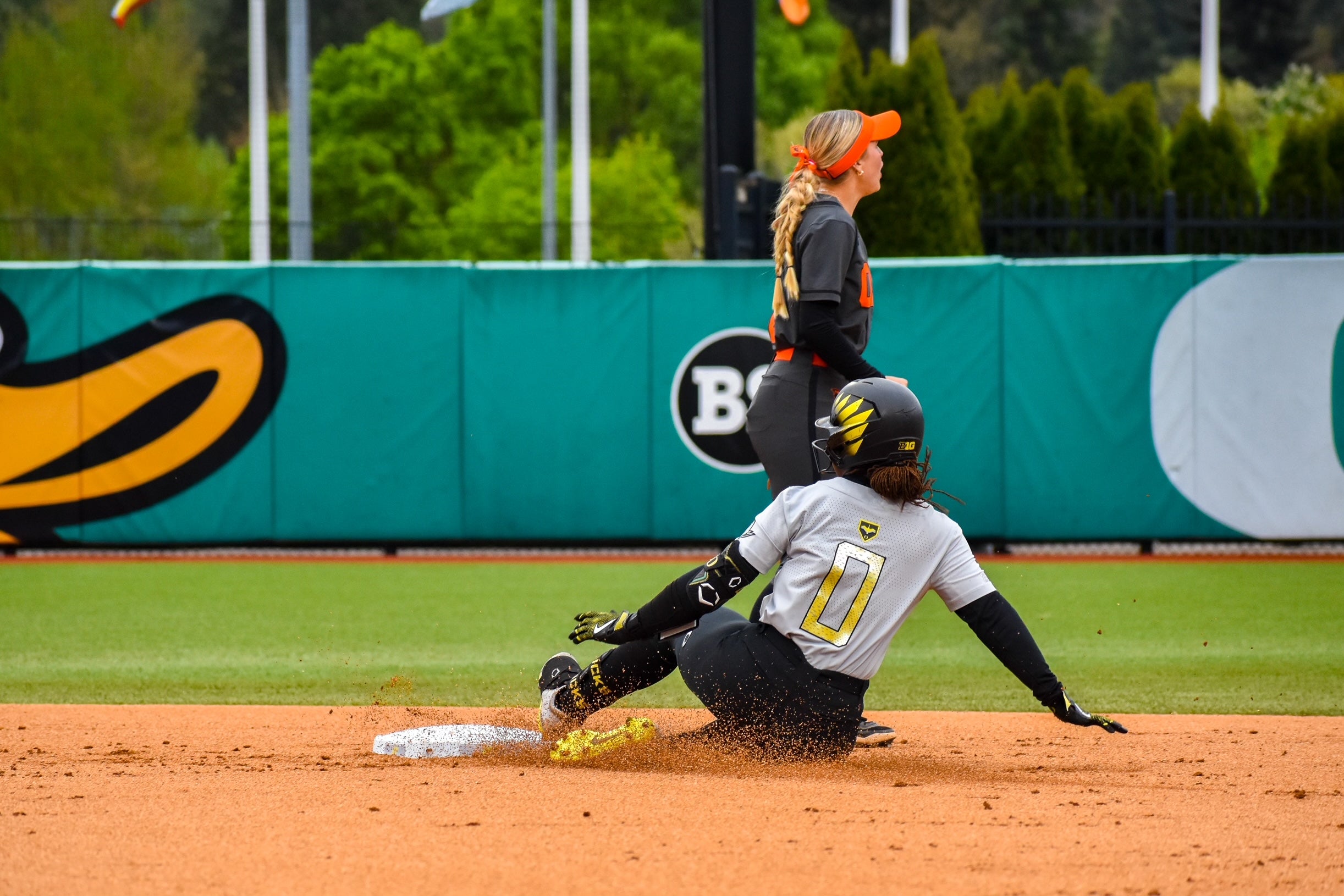 Elon Butler slides into second with a double in Oregon's 7-2 victory over Oregon State