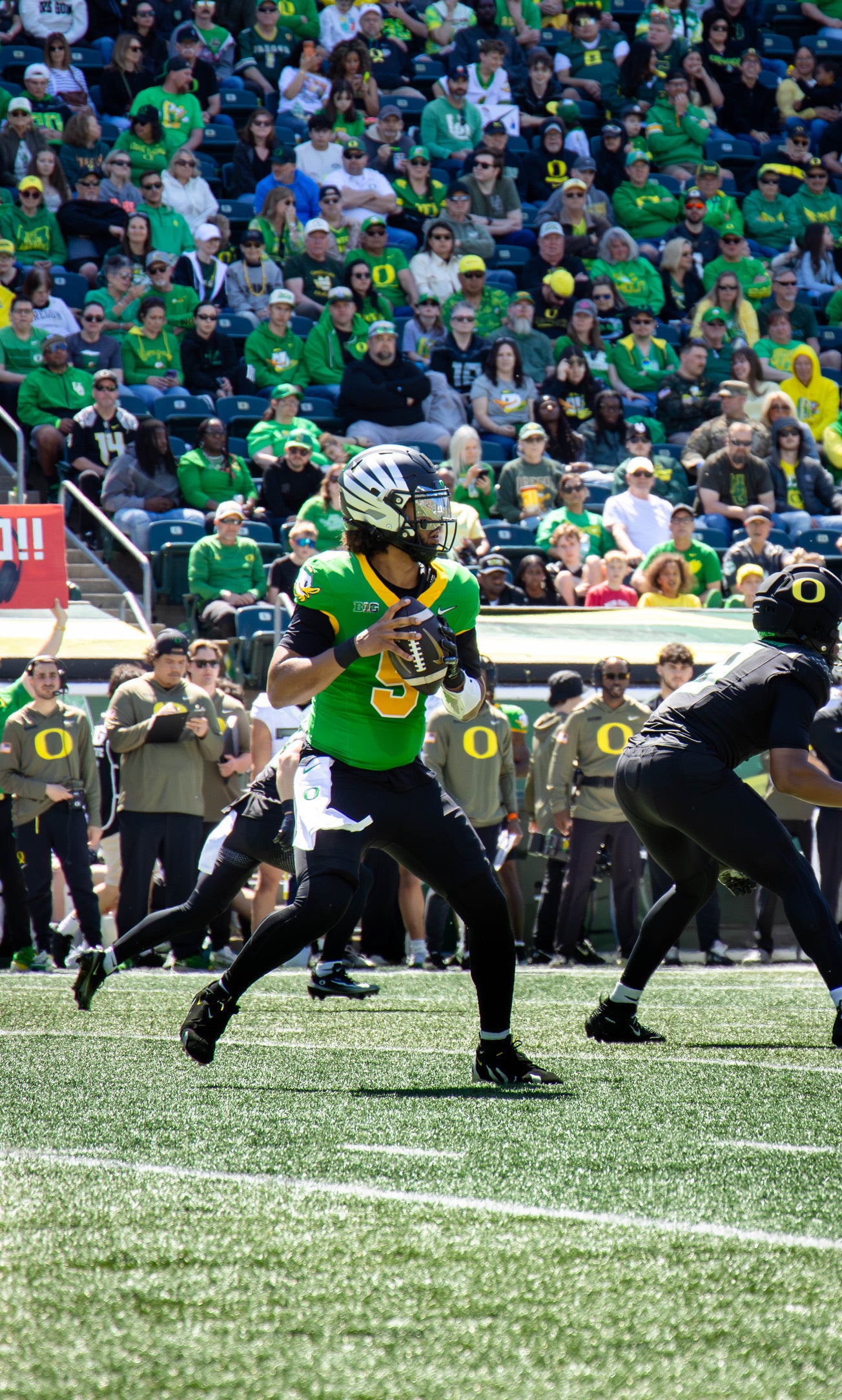 Oregon quarterback Dante Moore drops back to pass during the Ducks' spring football game